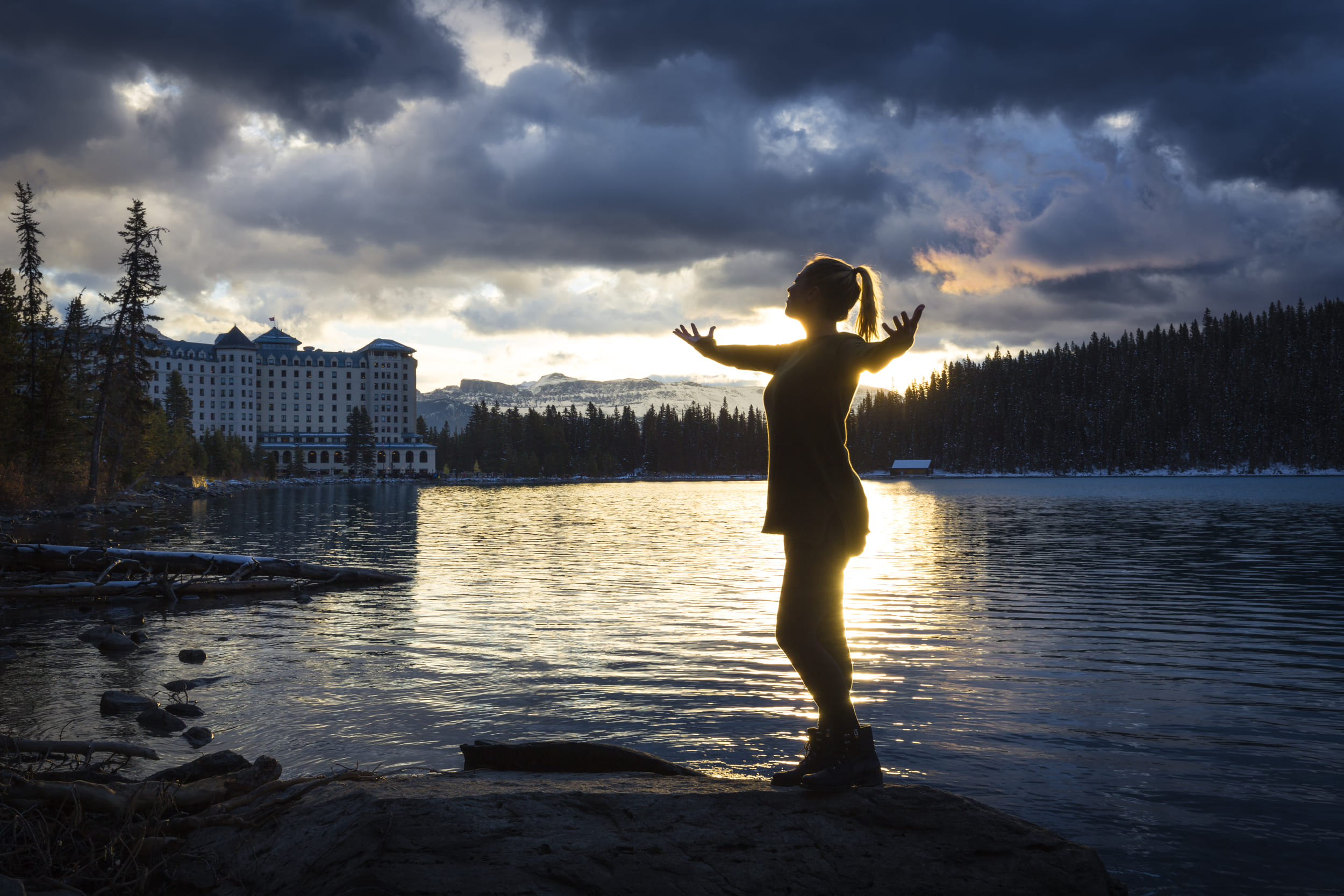 woman doing yoga near the lake