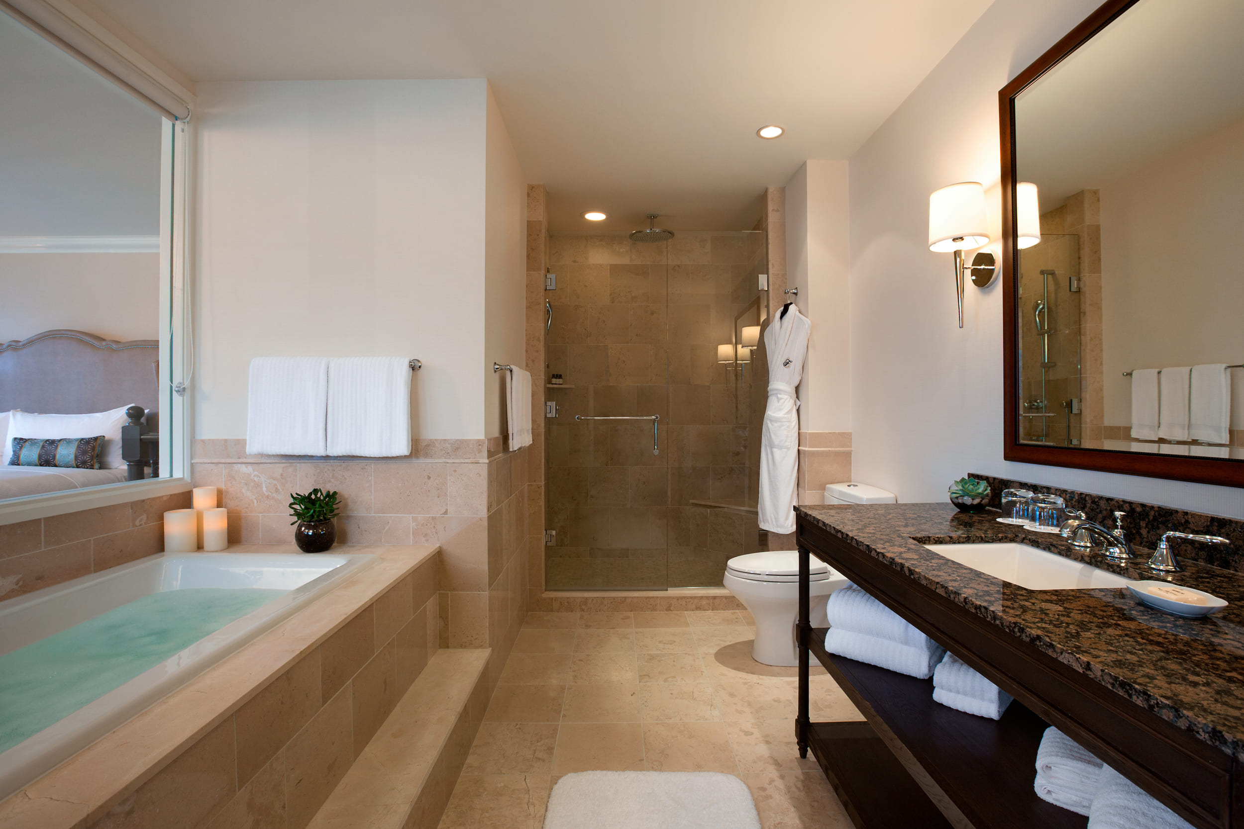 bathroom with walk0in shower and tub
