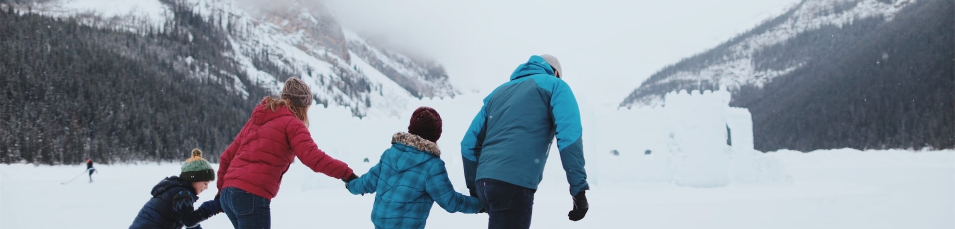 family skating on the lake