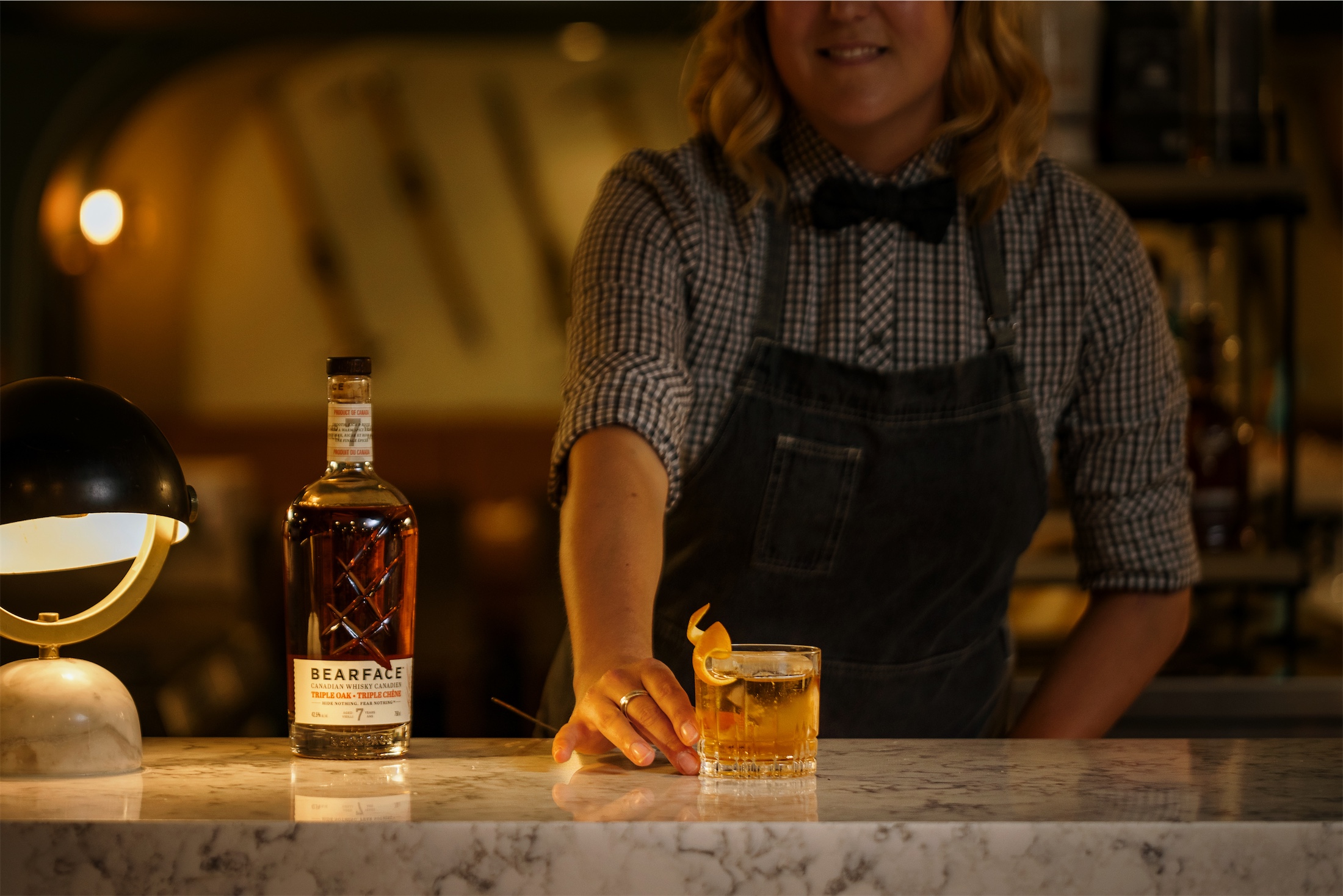 bartender serving whiskey