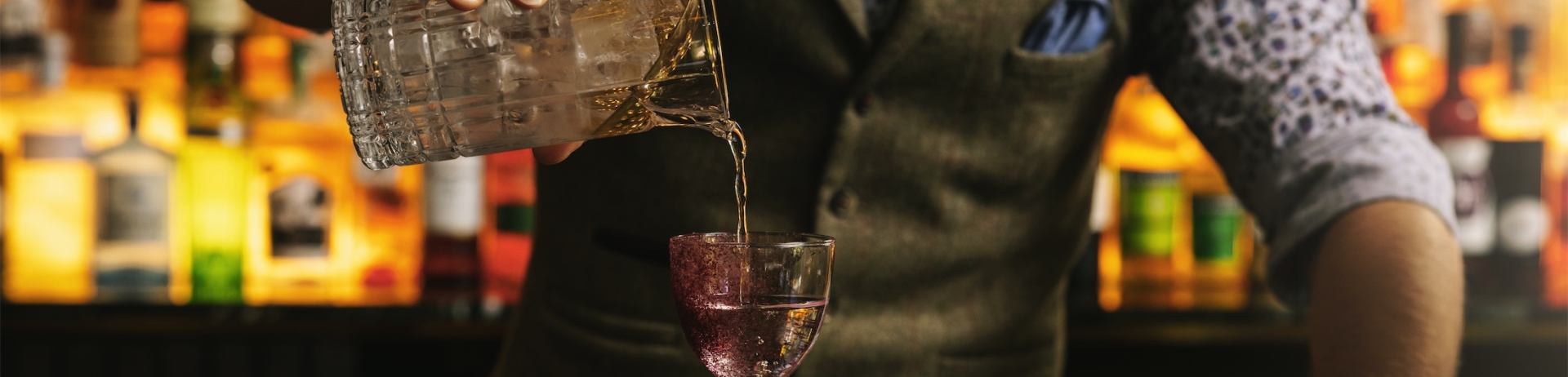 bartender pouring a drink