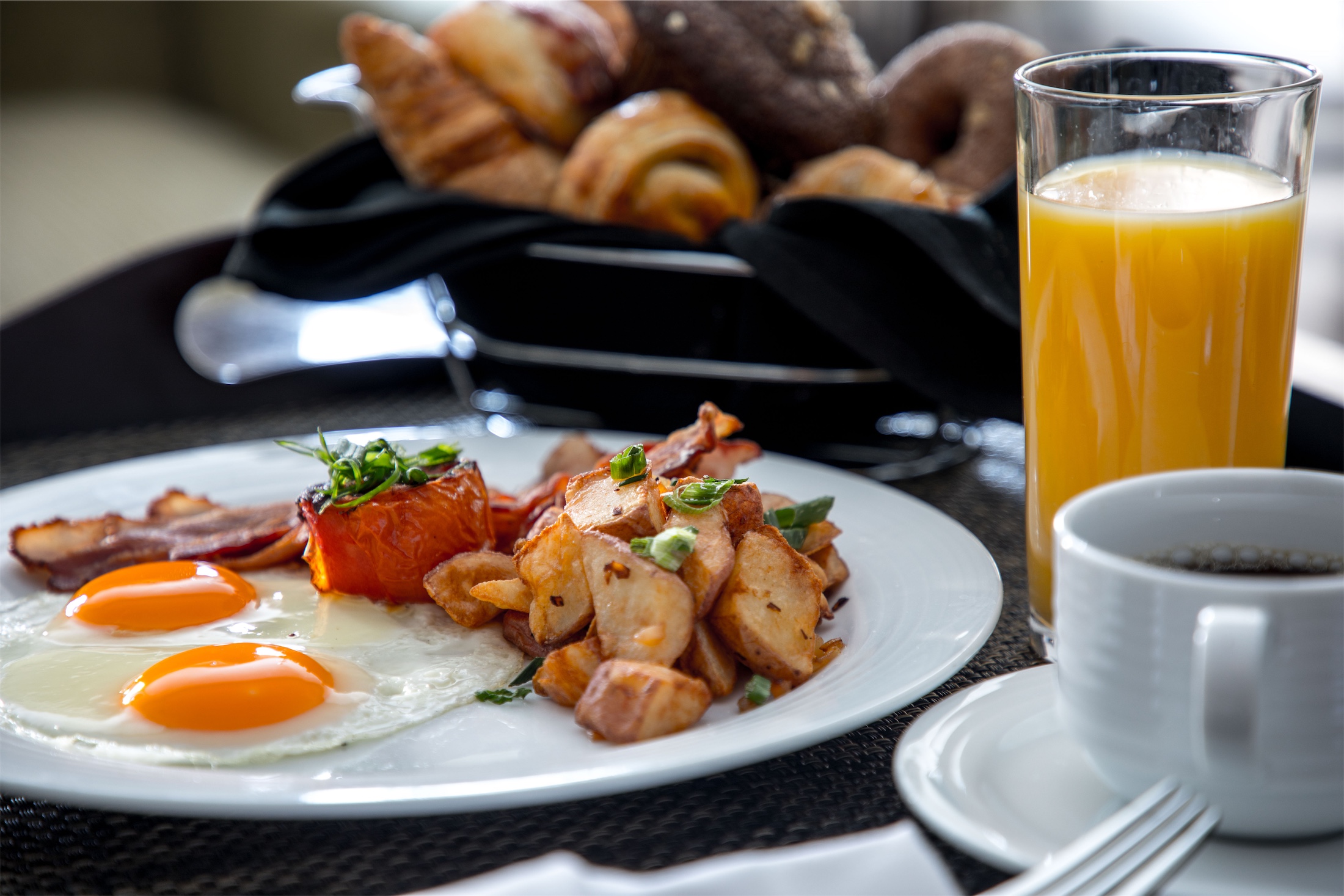 tray of breakfast with orange juice and coffee