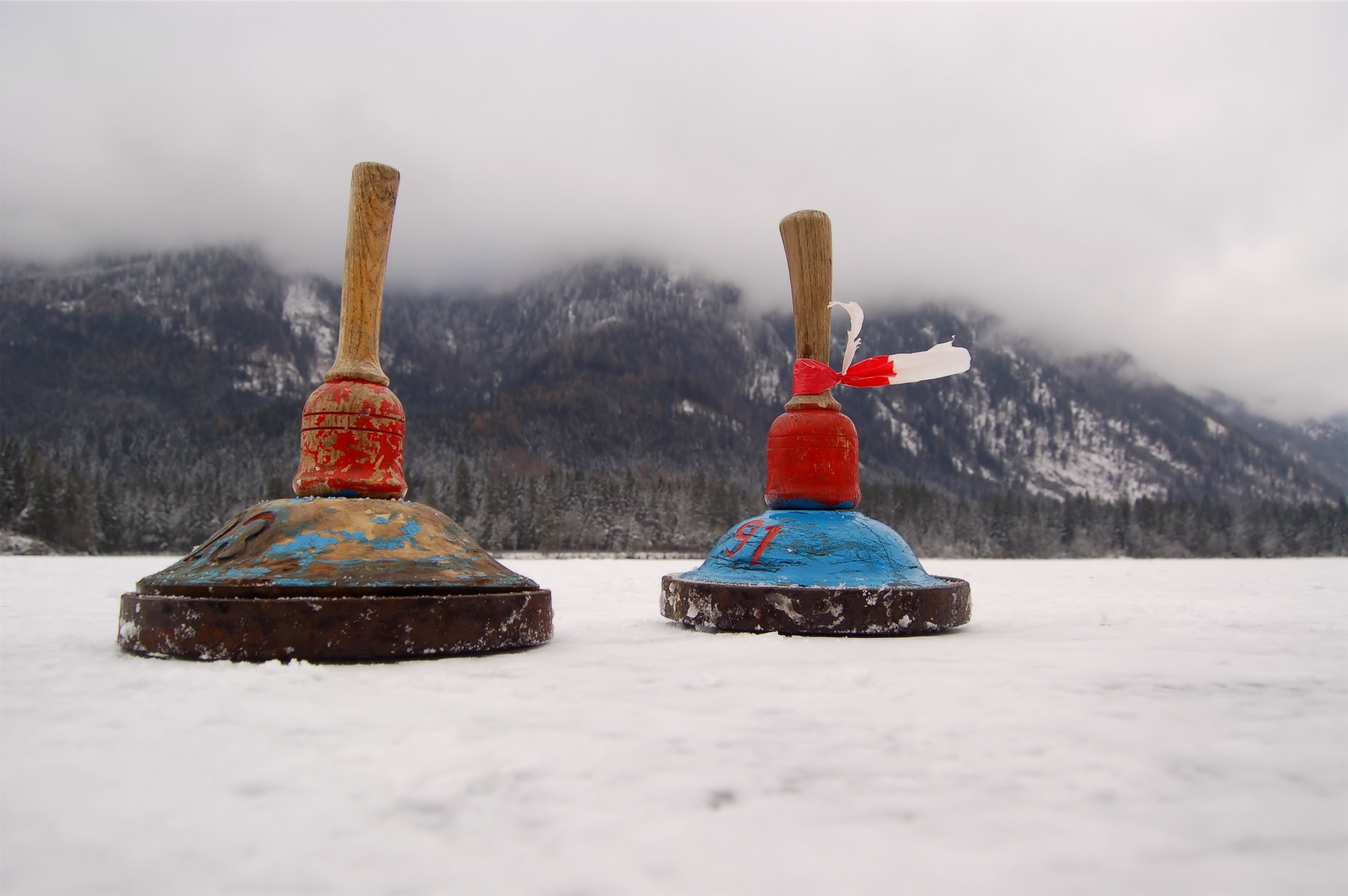 Two ice stocks in a game of Bavarian curling