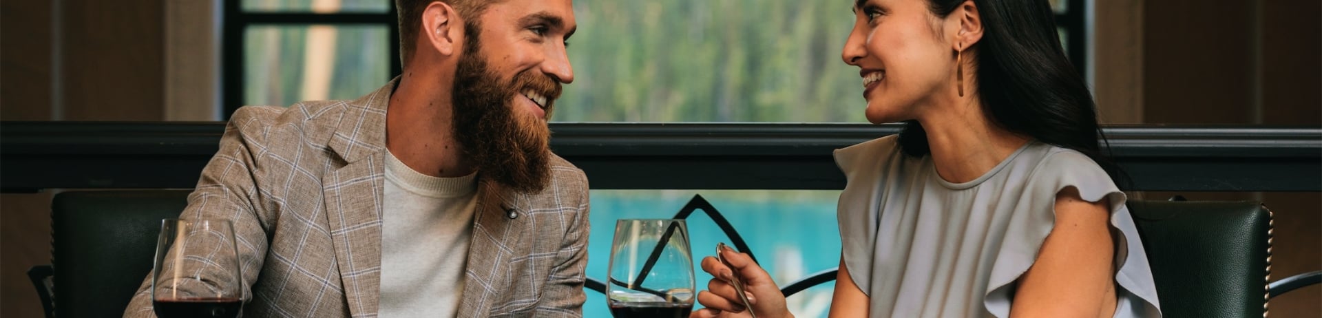 couple eating dinner and looking into each others eyes