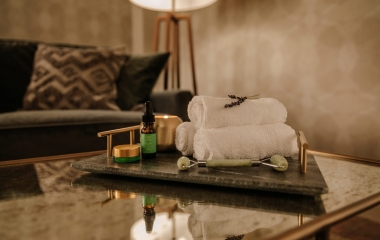 A tray of towels and facial accoutrements