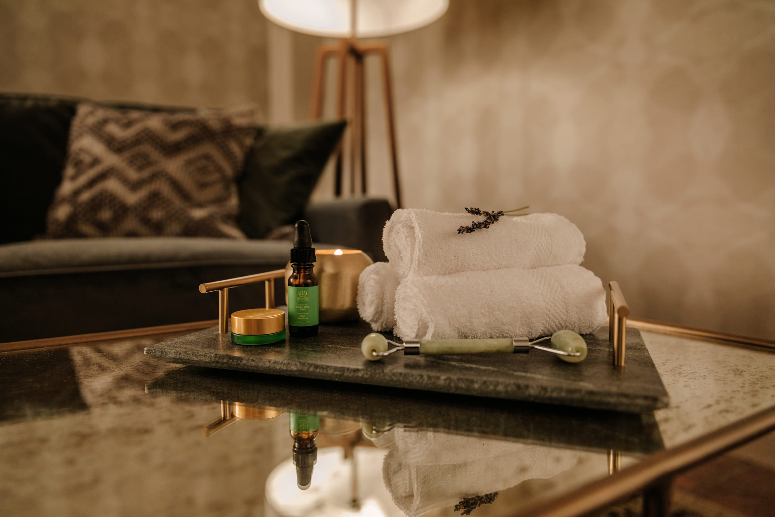 A tray of towels and facial accoutrements