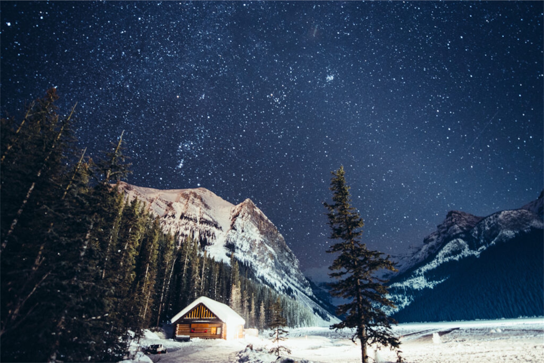 Starry Night over the frozen Lake Louise in winter, Banff National Park. Canada.