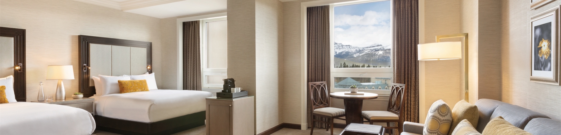 bedroom with two beds and a small sectional