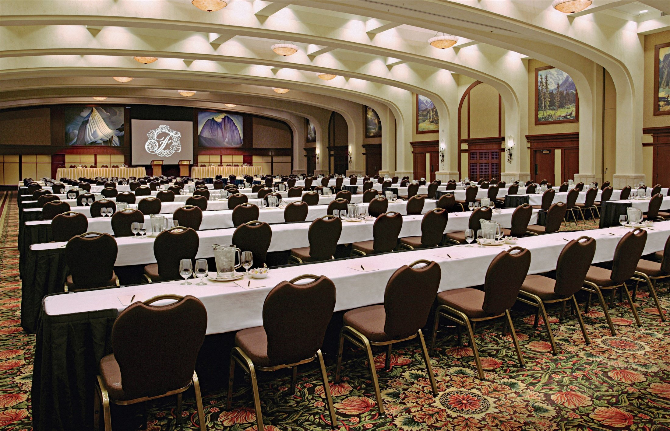 A large conference room set up with long meeting tables