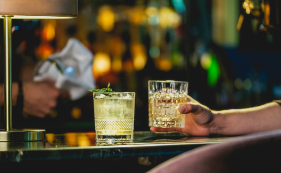 two cocktails on a bar