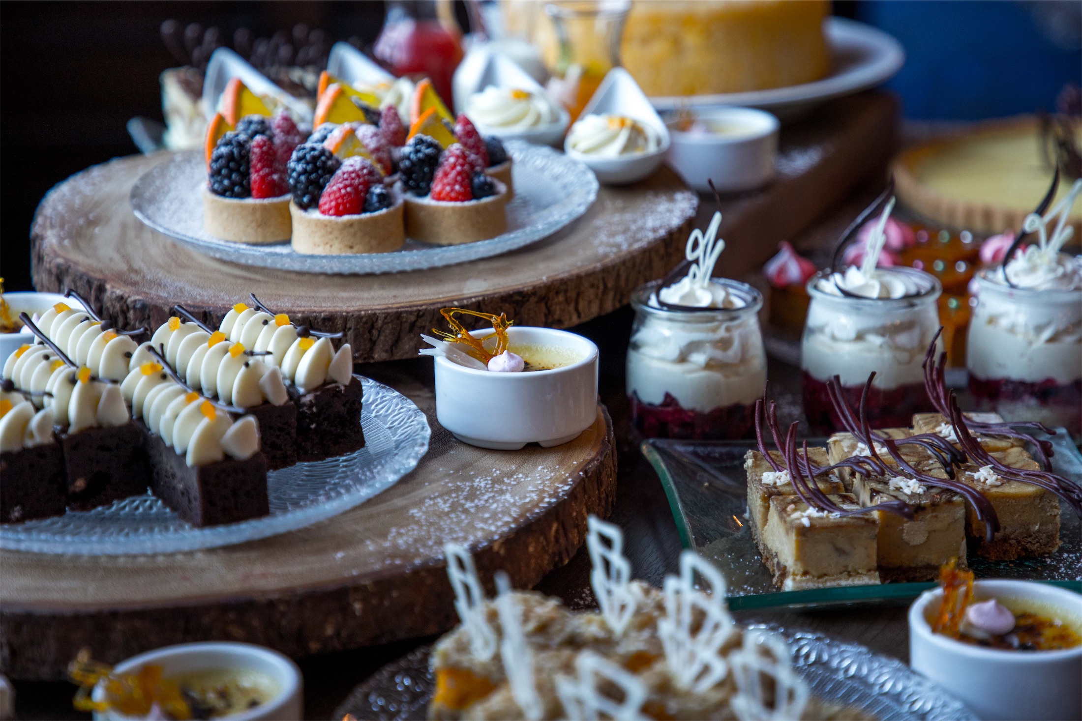A table loaded with a variety of pastries and sweets
