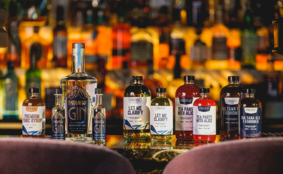 bottles of cocktails sit on table