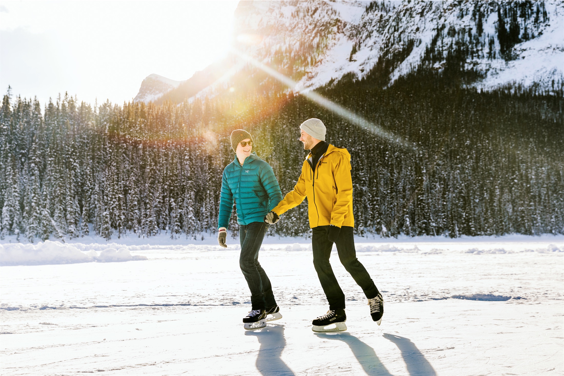 couple in green and yellow jackets skating