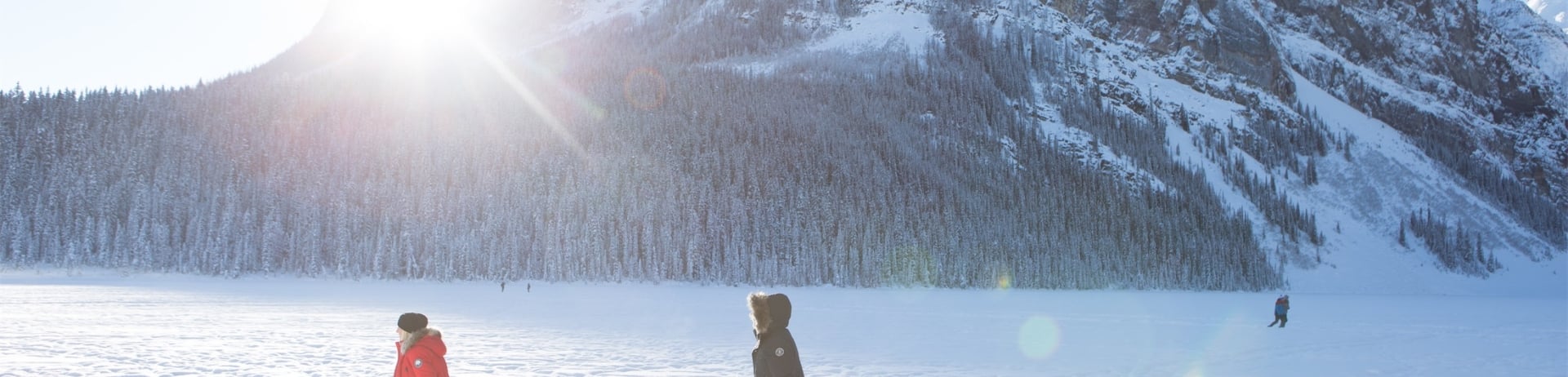 people walk outdoors in the snow