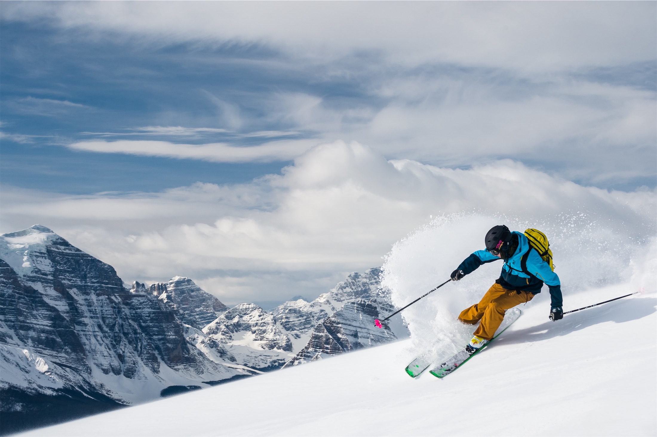 skier carves down the side of a mountain