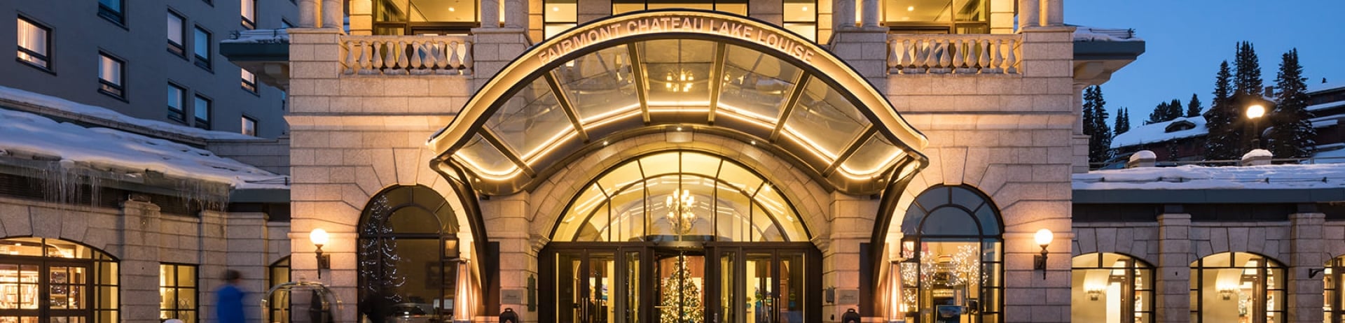 The exterior of Fairmont Chateau Lake Louise lit up at night