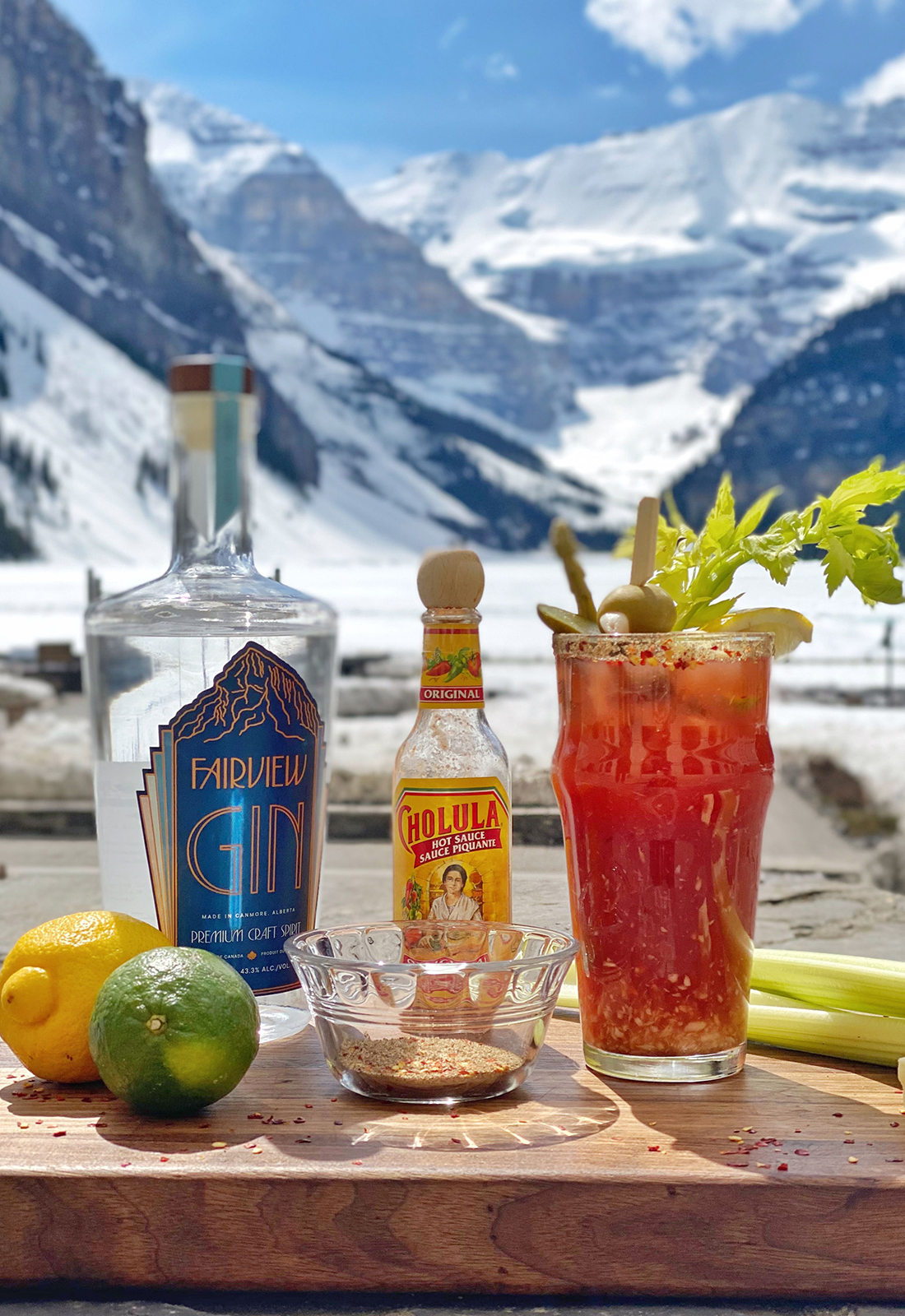 Classic Canadian Caesar cocktail with mountains in the background