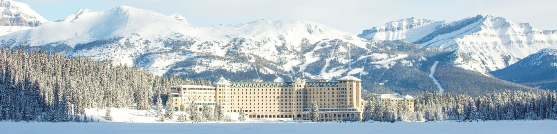 The exterior of Fairmont Chateau Lake Louise in winter