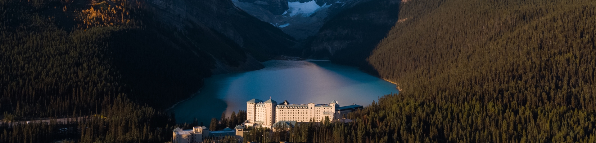 view of chateau lake louise with the lake and mountains in the background
