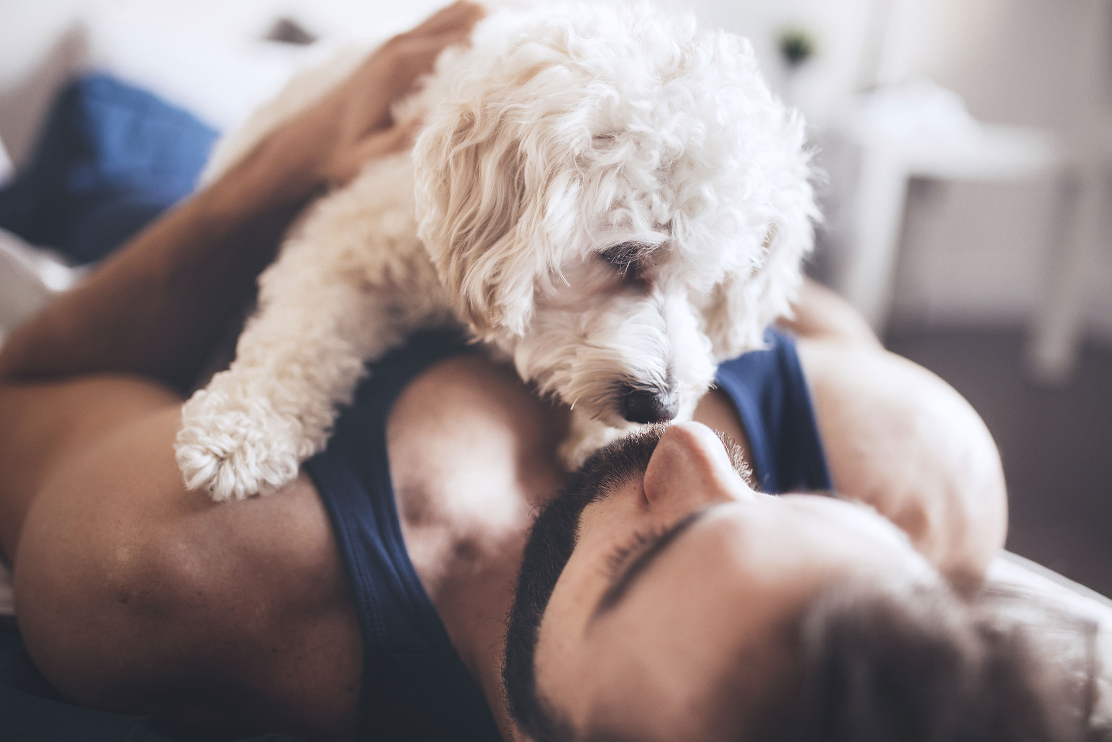woman with a dog sitting on her chest