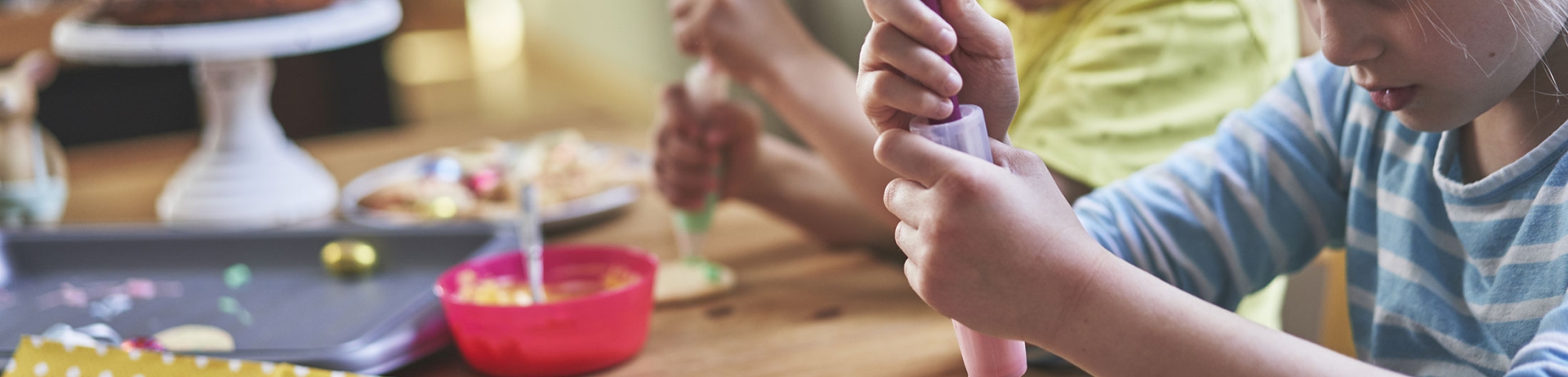 Children decorating Easter cookies