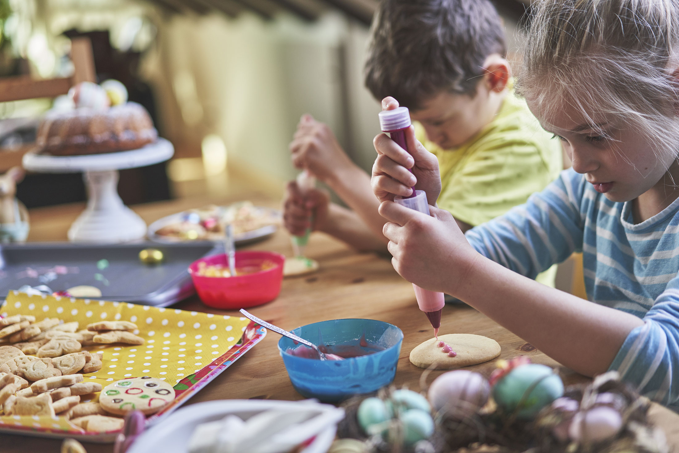 Children decorating Easter cookies