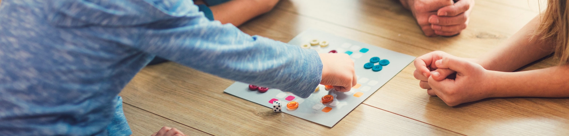 family playing board game
