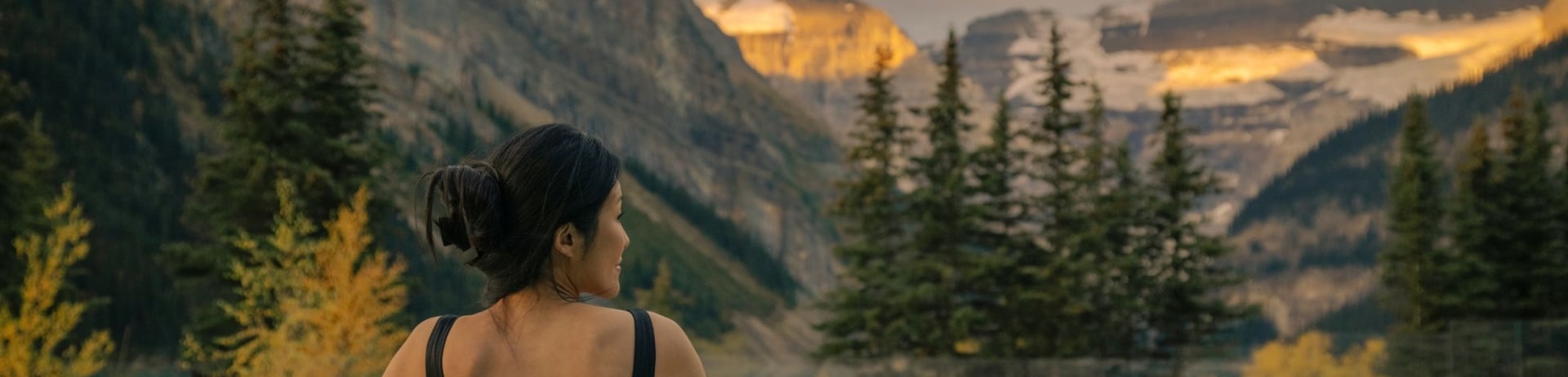 Female sitting in pool overlooking Victoria Glacier.